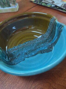 handmade apple shaped pottery bowl from clay in motion with and brown glaze